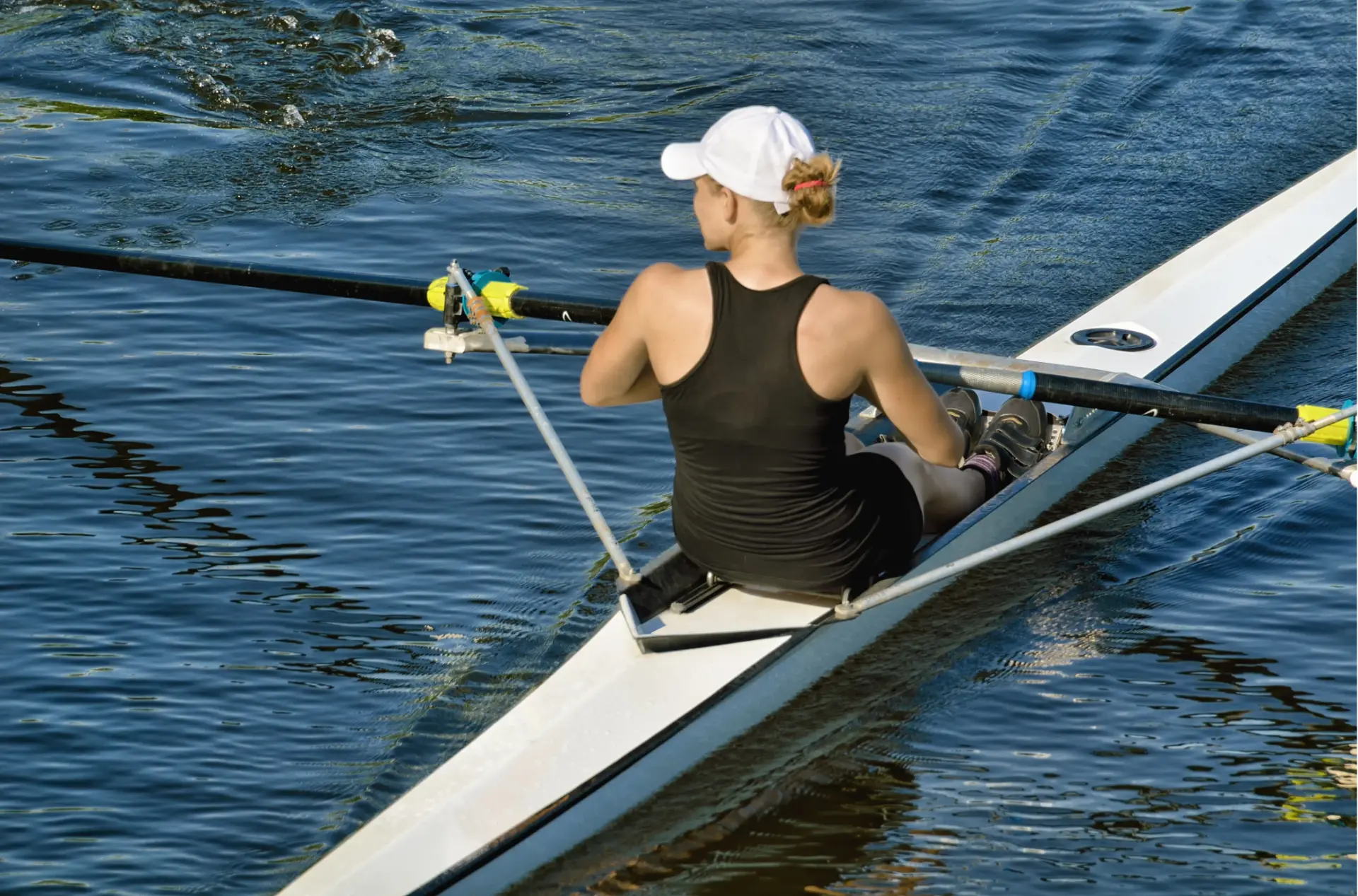 A rower sculling on the river